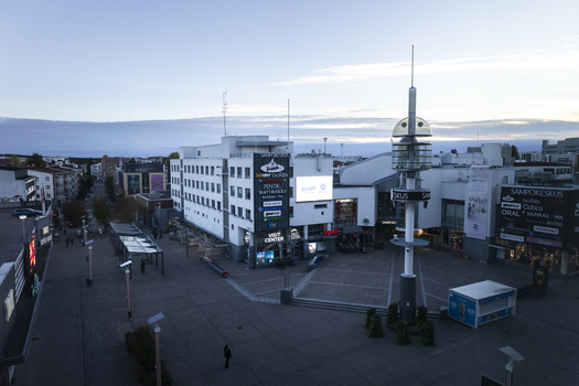 Rovaniemi Finland 19 September 2026 Aerial view of the Sampokeskus shopping center and town square featuring modern architecture a prominent tower and paved pedestrian areas.