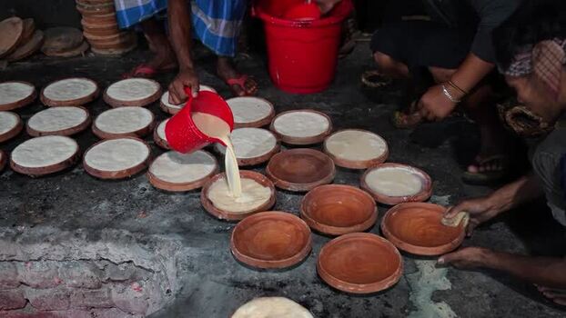 View of workers making traditional curd in Bogura Bangladesh. View of workers making traditional curd in Bogura Bangladesh.