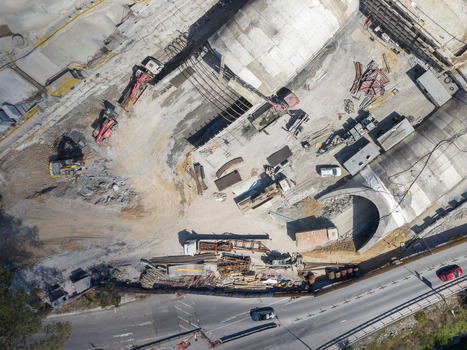 Aerial view of a construction site featuring a tunnel entrance heavy machinery and excavators located in Istanbul Istanbul Turkiye. Aerial view of a construction site featuring a tunnel entrance heavy machinery and excavators located in Istanbul Istanbul Turkiye.