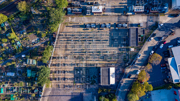 Aerial view of an electricity sub station with transformers and switchgear surrounded by roads and greenery in Camberley England United Kingdom. Aerial view of an electricity sub station with transformers and switchgear surrounded by roads and greenery in Camberley England United Kingdom.