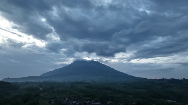 Aerial view of a mountain under a cloudy sky Indonesia. Aerial view of a mountain under a cloudy sky Indonesia.