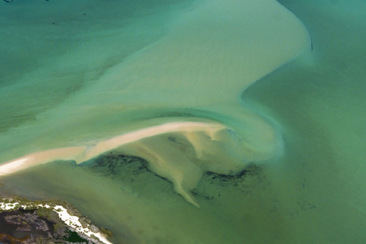 Aerial view of the intricate sandbars and turquoise ocean patterns in the shallow waters of the Shire of Shark Bay Western Australia Australia. Aerial view of the intricate sandbars and turquoise ocean patterns in the shallow waters of the Shire of Shark Bay Western Australia Australia.