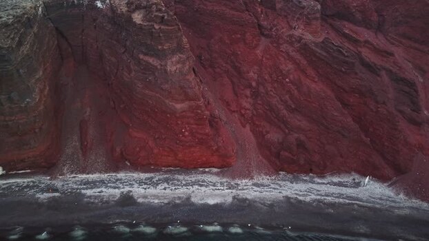 Aerial view of the Red beach volcanic cliffs Greece.