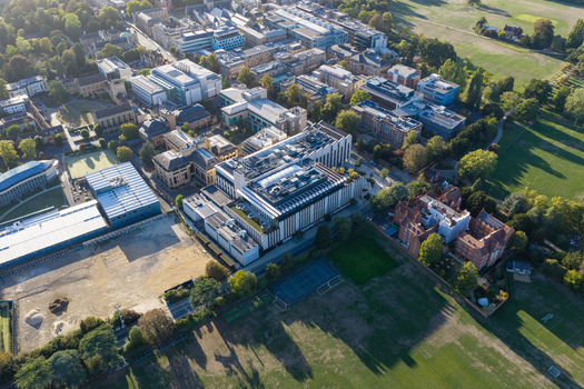 Aerial view of the Data Center at Oxford University featuring modern architecture surrounding academic buildings green spaces and tennis courts in Oxford England United Kingdom. Aerial view of the Data Center at Oxford University featuring modern architecture surrounding academic buildings green spaces and tennis courts in Oxford England United Kingdom.
