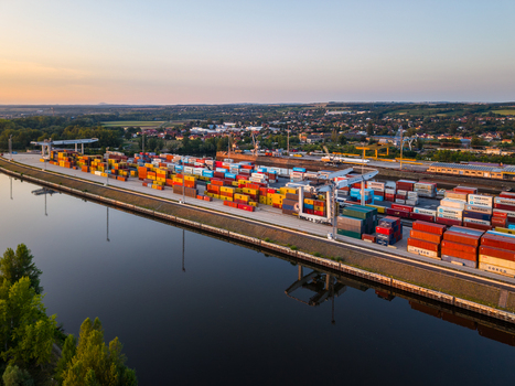 Melnik Stredocesky kraj Czechia 03 August 2026 Aerial view of Terminal Ceske Pristavy with colorful shipping containers stacked along the riverbank at sunset. Melnik Stredocesky kraj Czechia 03 August 2026 Aerial view of Terminal Ceske Pristavy with colorful shipping containers stacked along the riverbank at sunset.