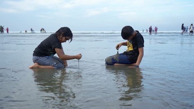 View of children playing on the beach in Cox s Bazar Bangladesh. View of children playing on the beach in Cox s Bazar Bangladesh.