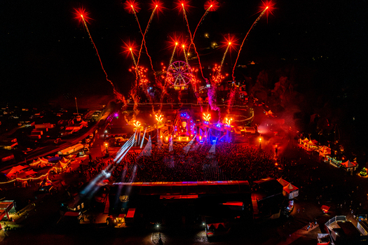 Herzogenaurach Germany 27 July 2025 Aerial view of the Open Beatz Festival featuring red fireworks a large crowd and a Ferris wheel at night. Herzogenaurach Germany 27 July 2025 Aerial view of the Open Beatz Festival featuring red fireworks a large crowd and a Ferris wheel at night.