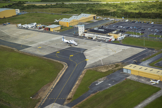 Waterford Regional Airport Ireland 02 July 2015 Aerial view of Waterford Airport featuring a small passenger aircraft on the apron the control tower and terminal building.