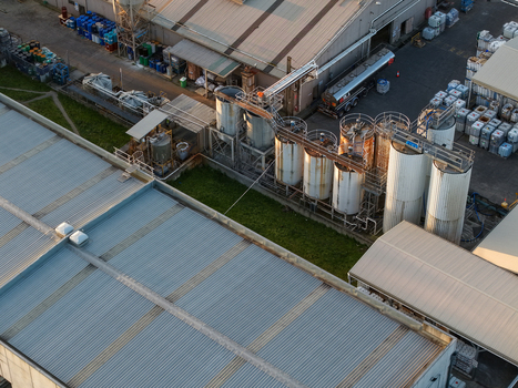 Melbourne Australia 22 September 2026 Aerial view of industrial factories in Kilsyth featuring large metal storage tanks corrugated metal roofing and storage containers. Melbourne Australia 22 September 2026 Aerial view of industrial factories in Kilsyth featuring large metal storage tanks corrugated metal roofing and storage containers.