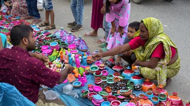 View of a street vendor selling colorful clay toys Bangladesh. View of a street vendor selling colorful clay toys Bangladesh.