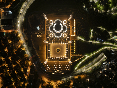 Aerial view of Grand Camlica Mosque illuminated at night with its intricate architectural details and surrounding parkland in Uskudar Istanbul Turkiye. Aerial view of Grand Camlica Mosque illuminated at night with its intricate architectural details and surrounding parkland in Uskudar Istanbul Turkiye.