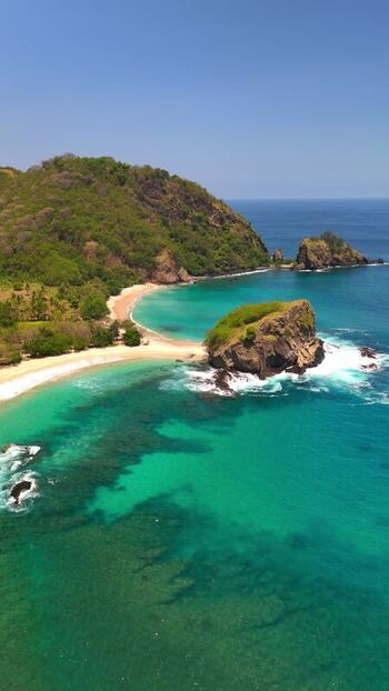 Aerial view of Koka Beach with turquoise water and rocky islets Indonesia. Aerial view of Koka Beach with turquoise water and rocky islets Indonesia.