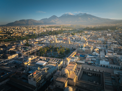 Aerial view of Plaza de Armas Arequipa with its historic cathedral and colonial architecture set against the backdrop of the snow capped Misti volcano in Arequipa Arequipa Peru. Aerial view of Plaza de Armas Arequipa with its historic cathedral and colonial architecture set against the backdrop of the snow capped Misti volcano in Arequipa Arequipa Peru.