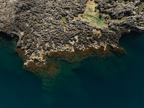Aerial view of the jagged rocky coastline and turquoise waters of the Plemmirio Marine Protected Area Plemmirio Sicily Italy. Aerial view of the jagged rocky coastline and turquoise waters of the Plemmirio Marine Protected Area Plemmirio Sicily Italy.