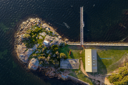 Aerial view of Camp Quaranup with its historic buildings long jetty and rocky coastline Vancouver Peninsula Western Australia Australia. Aerial view of Camp Quaranup with its historic buildings long jetty and rocky coastline Vancouver Peninsula Western Australia Australia.