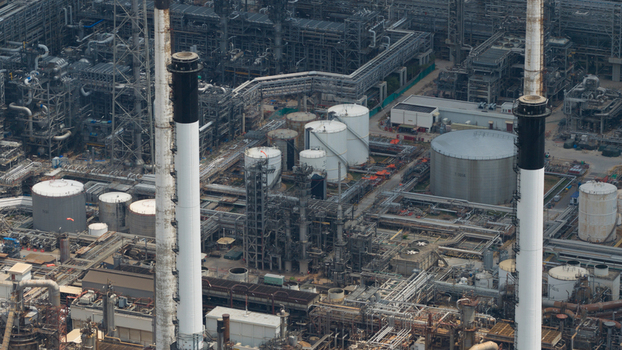 Aerial view of the Eastern Economic Corridor of Innovation EECi industrial complex with tall chimneys and storage tanks in Tambon Pa Yup Nai Chang Wat Rayong Thailand. Aerial view of the Eastern Economic Corridor of Innovation EECi industrial complex with tall chimneys and storage tanks in Tambon Pa Yup Nai Chang Wat Rayong Thailand.
