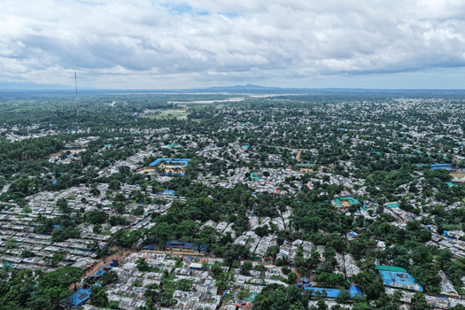 Aerial view of Kutupalang Camp 7 with dense rows of shelters lush green trees and pathways in Cox s Bazar District Chittagong Division Bangladesh.