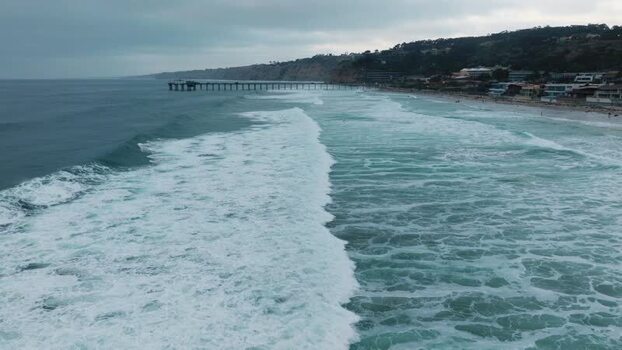Aerial view of waves and Scripps Pier United States.