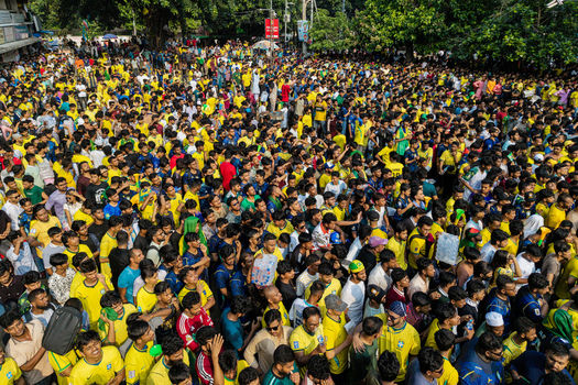 Dhaka Bangladesh 20 June 2026 Aerial view of a massive crowd of football fans wearing yellow jerseys gathered at Dhaka University Campus. Dhaka Bangladesh 20 June 2026 Aerial view of a massive crowd of football fans wearing yellow jerseys gathered at Dhaka University Campus.