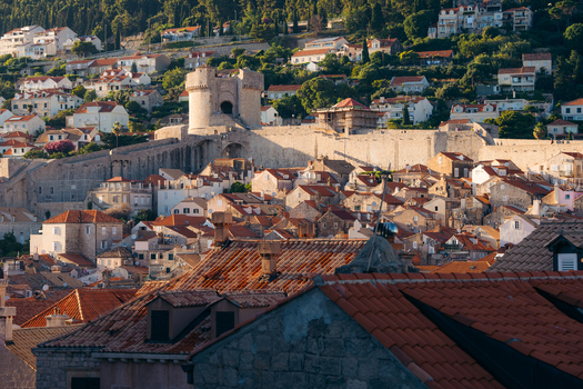 View of the historic red tiled rooftops and the medieval Minceta Tower along the ancient city walls of Dubrovnik Dubrovnik Neretva Croatia. View of the historic red tiled rooftops and the medieval Minceta Tower along the ancient city walls of Dubrovnik Dubrovnik Neretva Croatia.