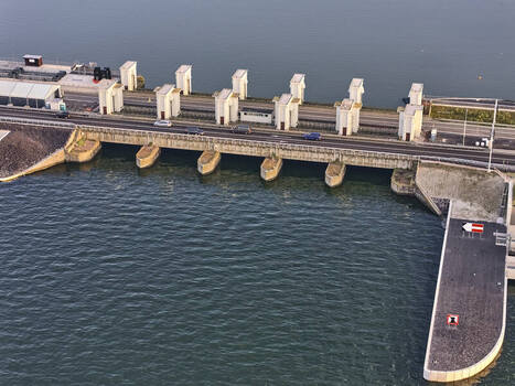 Den Oever Netherlands 19 June 2026 Aerial view of Stevinsluizen showing the sluice dam with concrete piers and road bridge undergoing renewal with new fish friendly pumping stations. Den Oever Netherlands 19 June 2026 Aerial view of Stevinsluizen showing the sluice dam with concrete piers and road bridge undergoing renewal with new fish friendly pumping stations.
