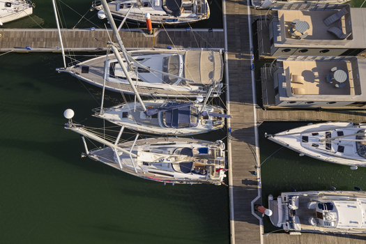 Aerial view of sailboats moored at the marina in Yarmouth Isle of Wight United Kingdom. Aerial view of sailboats moored at the marina in Yarmouth Isle of Wight United Kingdom.