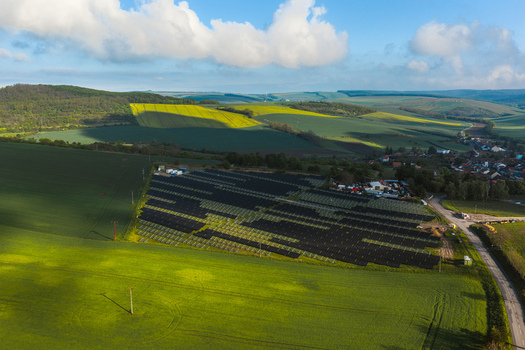 Aerial view of FVE Bohumilice solar power plant surrounded by green agricultural fields and rolling hills in Klobouky u Brna Jihomoravsky kraj Czechia. Aerial view of FVE Bohumilice solar power plant surrounded by green agricultural fields and rolling hills in Klobouky u Brna Jihomoravsky kraj Czechia.