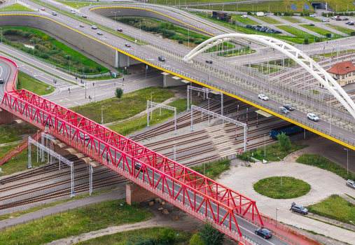 Aerial view of the red truss bridge in Letnica with modern highway overpasses and railway tracks in Gdansk Pomeranian Voivodeship Poland. Aerial view of the red truss bridge in Letnica with modern highway overpasses and railway tracks in Gdansk Pomeranian Voivodeship Poland.