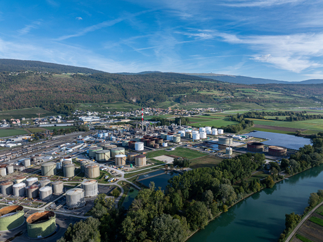 Aerial view of the Cressier Refinery featuring industrial storage tanks and processing facilities situated near the river in Cornaux Neuchatel Switzerland. Aerial view of the Cressier Refinery featuring industrial storage tanks and processing facilities situated near the river in Cornaux Neuchatel Switzerland.