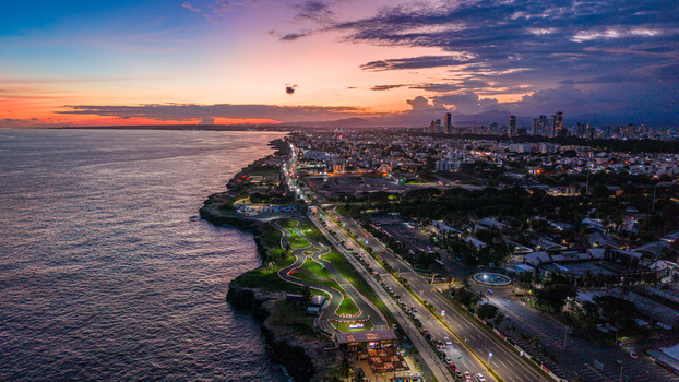 Aerial view of the coastline and cityscape of Santo Domingo featuring the Feria Ganadera area along the Caribbean Sea at sunset Santo Domingo Distrito Nacional Dominican Republic. Aerial view of the coastline and cityscape of Santo Domingo featuring the Feria Ganadera area along the Caribbean Sea at sunset Santo Domingo Distrito Nacional Dominican Republic.