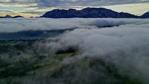 Aerial view of Attersee lake above clouds in Upper Austria Austria.