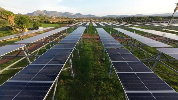 Aerial view of solar panels in a field in Terrasini Italy.