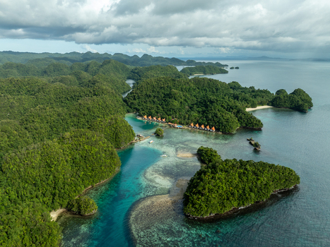 Aerial view of Bucas Grande featuring lush karst islands turquoise waters and a resort with thatched roof cottages nestled along the coastline Siargao Philippines. Aerial view of Bucas Grande featuring lush karst islands turquoise waters and a resort with thatched roof cottages nestled along the coastline Siargao Philippines.