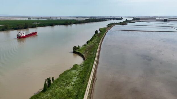 Aerial view of a cargo ship on the Guadalquivir river Spain. Aerial view of a cargo ship on the Guadalquivir river Spain.