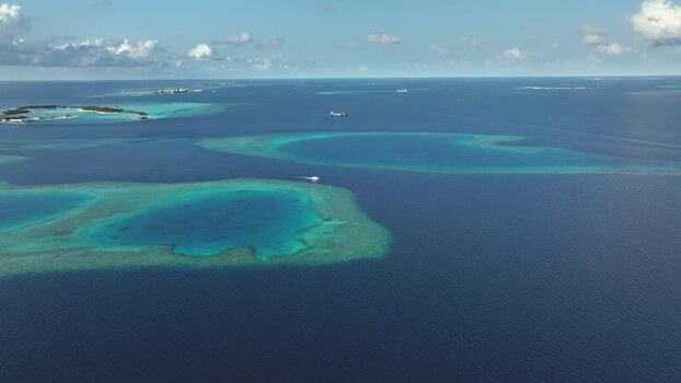 Aerial view of turquoise coral reefs and tropical islands Maldives. Aerial view of turquoise coral reefs and tropical islands Maldives.