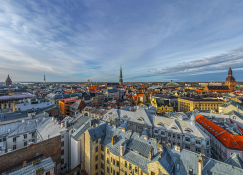 Aerial view of the historic city center of Riga with its iconic church spires and rooftops under a clear blue sky in Riga Latvia. Aerial view of the historic city center of Riga with its iconic church spires and rooftops under a clear blue sky in Riga Latvia.