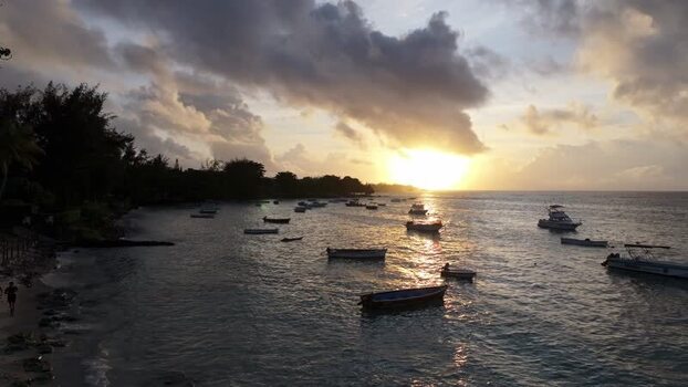 Aerial view of Cap Malheureux at sunset with boats Mauritius.
