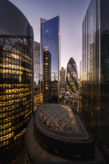 Aerial view of The Garden at 120 rooftop garden surrounded by modern skyscrapers including The Gherkin in the financial district of London England United Kingdom. Aerial view of The Garden at 120 rooftop garden surrounded by modern skyscrapers including The Gherkin in the financial district of London England United Kingdom.