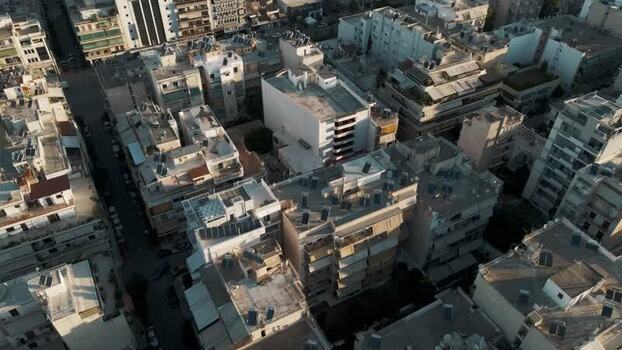Aerial view of urban rooftops and apartment buildings in Greece.