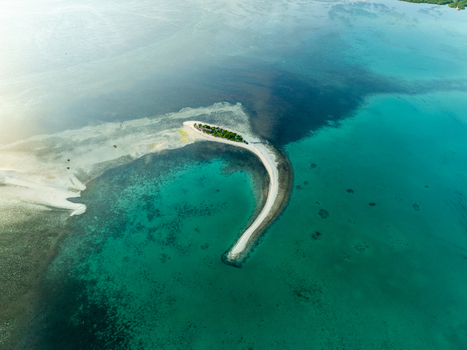 Aerial view of Pungtud sandbank surrounded by vibrant turquoise waters and coral reefs in Panglao Philippines. Aerial view of Pungtud sandbank surrounded by vibrant turquoise waters and coral reefs in Panglao Philippines.