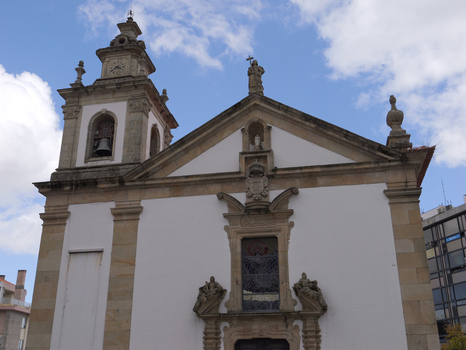 View of the Igreja da Misericordia da Covilha featuring a stone bell tower ornate facade and religious statues in Covilha Castelo Branco District Portugal.