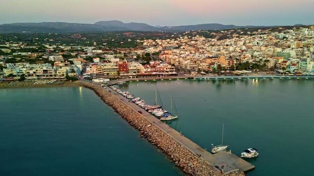 Aerial view of harbor and stone pier in Crete Greece.