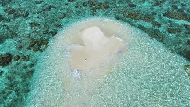 Aerial view of a sandbank surrounded by turquoise water Maldives. Aerial view of a sandbank surrounded by turquoise water Maldives.