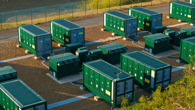 Aerial view of Battery Energy park BESS Grendon with green battery storage containers arranged on gravel ground in Northampton England United Kingdom. Aerial view of Battery Energy park BESS Grendon with green battery storage containers arranged on gravel ground in Northampton England United Kingdom.