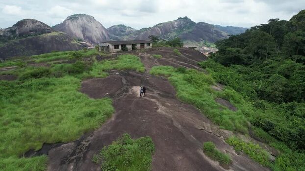 Aerial view of Idanre Hills with people on rocky terrain Nigeria.
