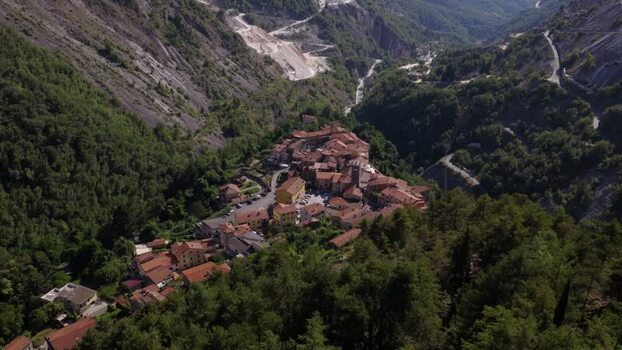 Aerial view of Colonnata village in the mountains Italy. Aerial view of Colonnata village in the mountains Italy.
