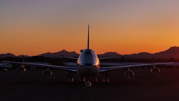 Aerial view of parked airplanes at sunset United States. Aerial view of parked airplanes at sunset United States.