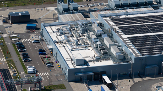 Aerial view of the HGB industrial facility featuring rooftop HVAC systems solar panels and a parking lot in Winschoten Groningen Netherlands.
