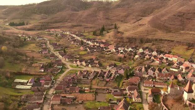 Aerial view of a rural village in a valley Romania. Aerial view of a rural village in a valley Romania.