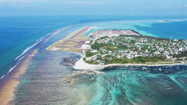 Aerial view of Dhaalu Airport and Kudahuvadhoo island Maldives. Aerial view of Dhaalu Airport and Kudahuvadhoo island Maldives.